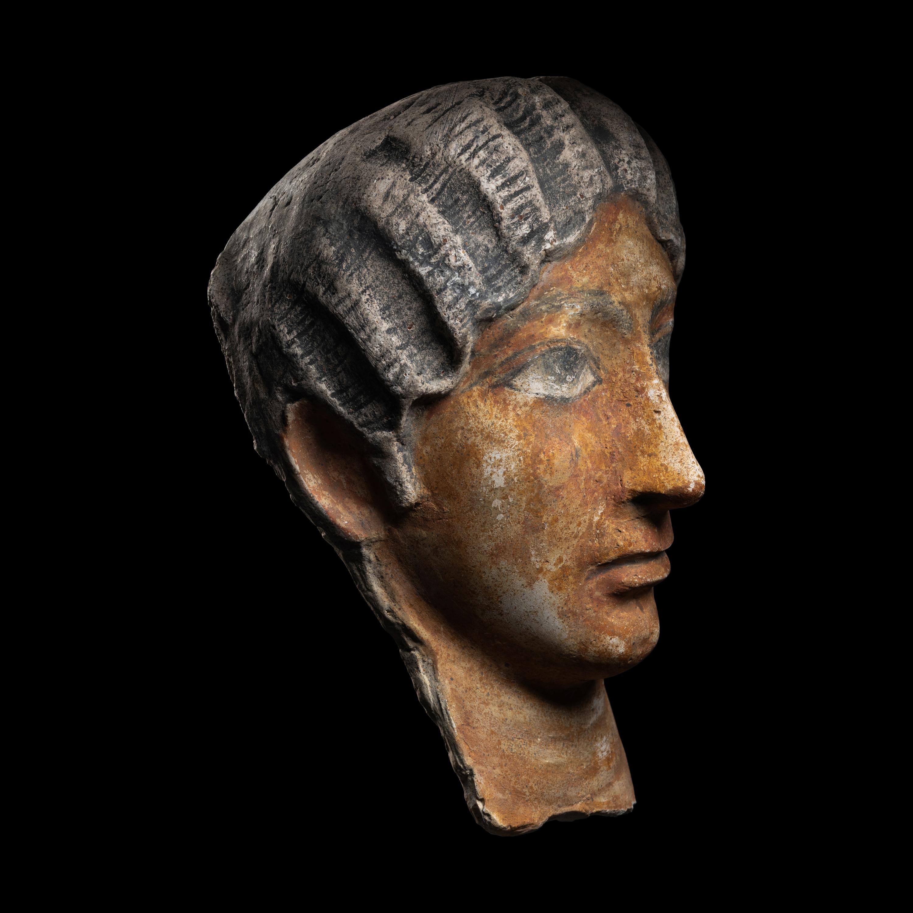 A Romano-Egyptian Painted Stucco Portrait Head of a Woman