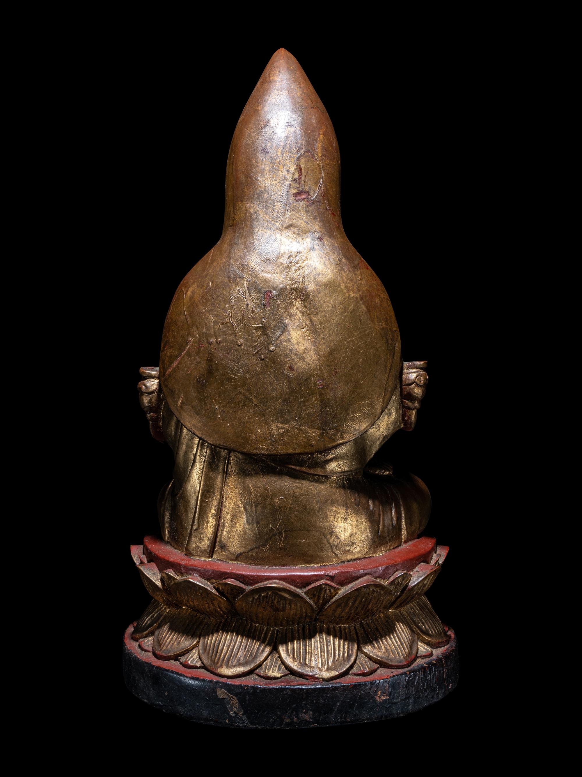 A Tibetan Gilt Lacquered Wood Figure of Tsongkapa