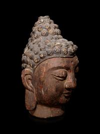 A Carved Wood Head of Buddha
