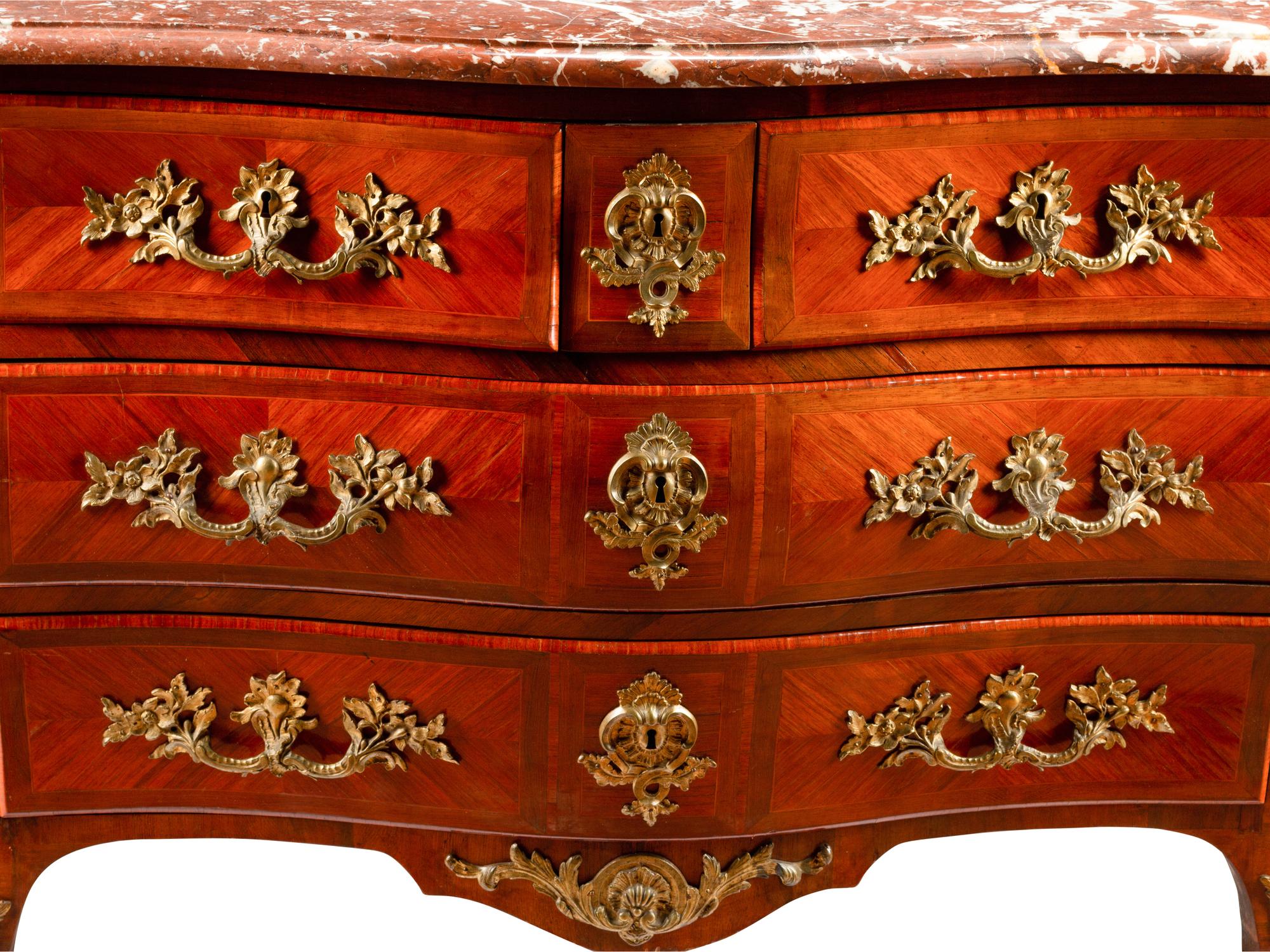A Régence Style Gilt Bronze Mounted Kingwood Marble-Top Commode