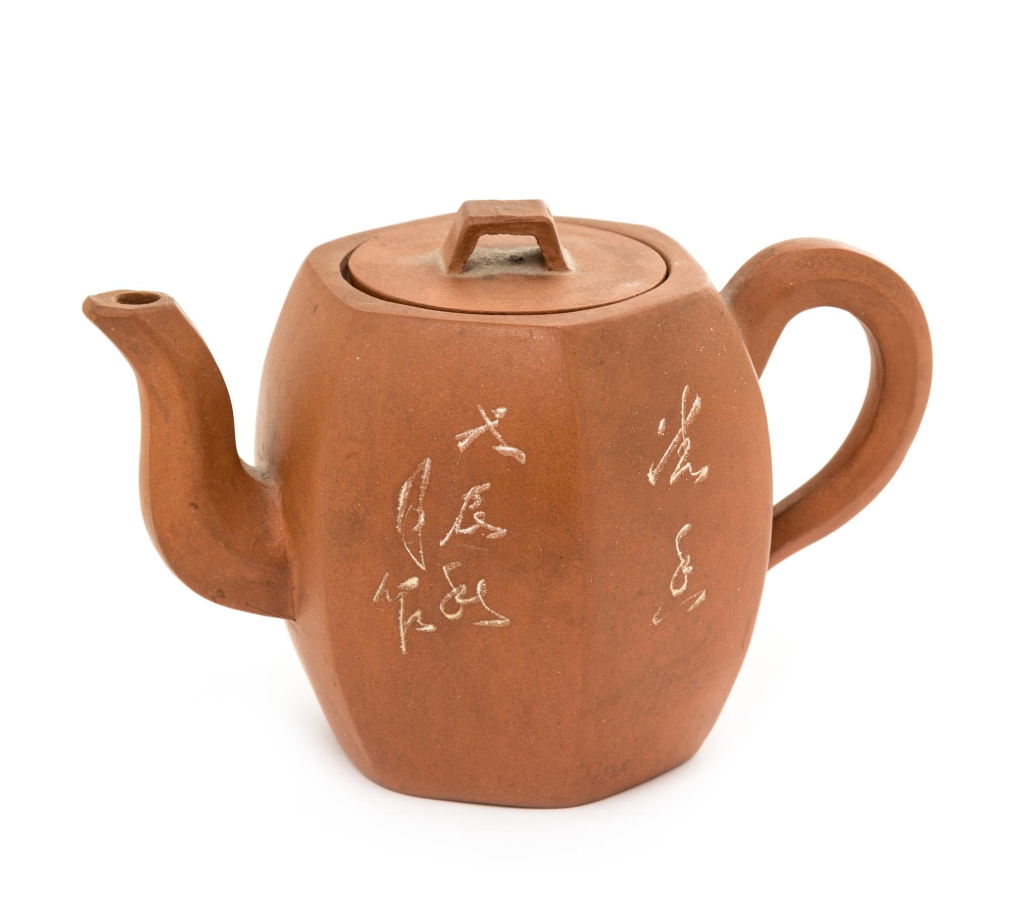 A Yixing Pottery Teapot Height 3 3/4 inches.