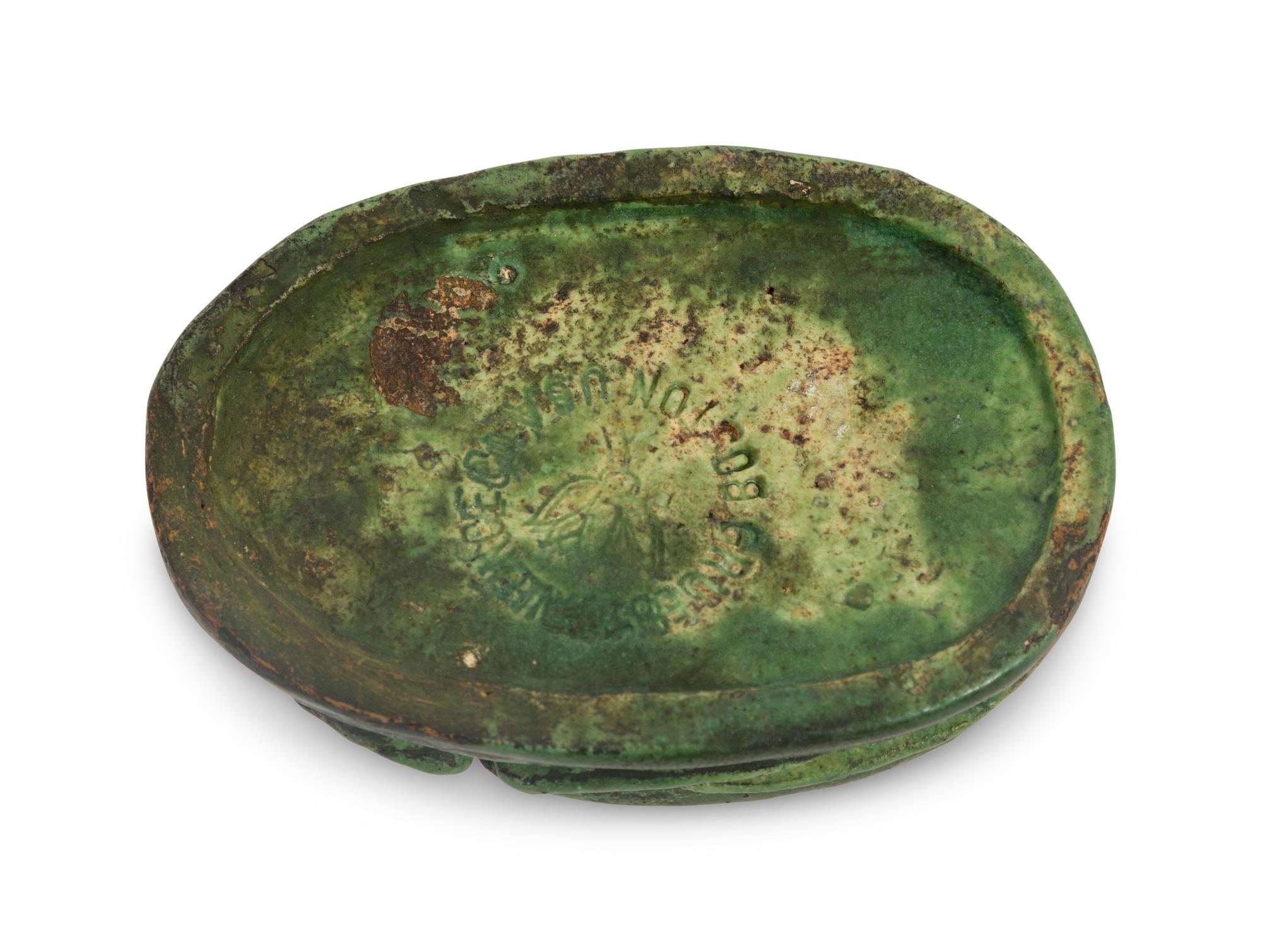 A Grueby Pottery Matte Green Scarab Paperweight