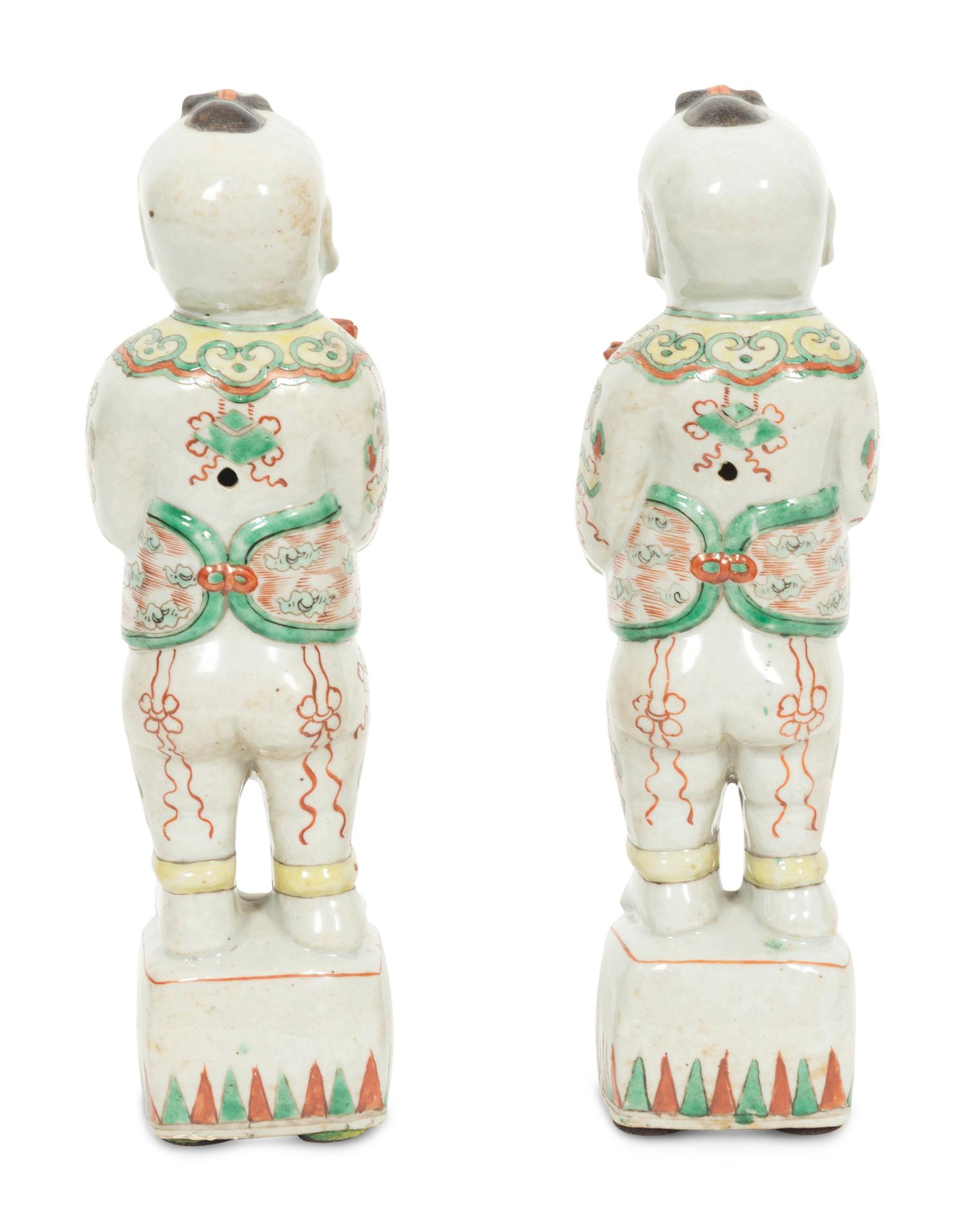 A Pair of Chinese Porcelain Figures of Boys