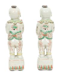 A Pair of Chinese Porcelain Figures of Boys