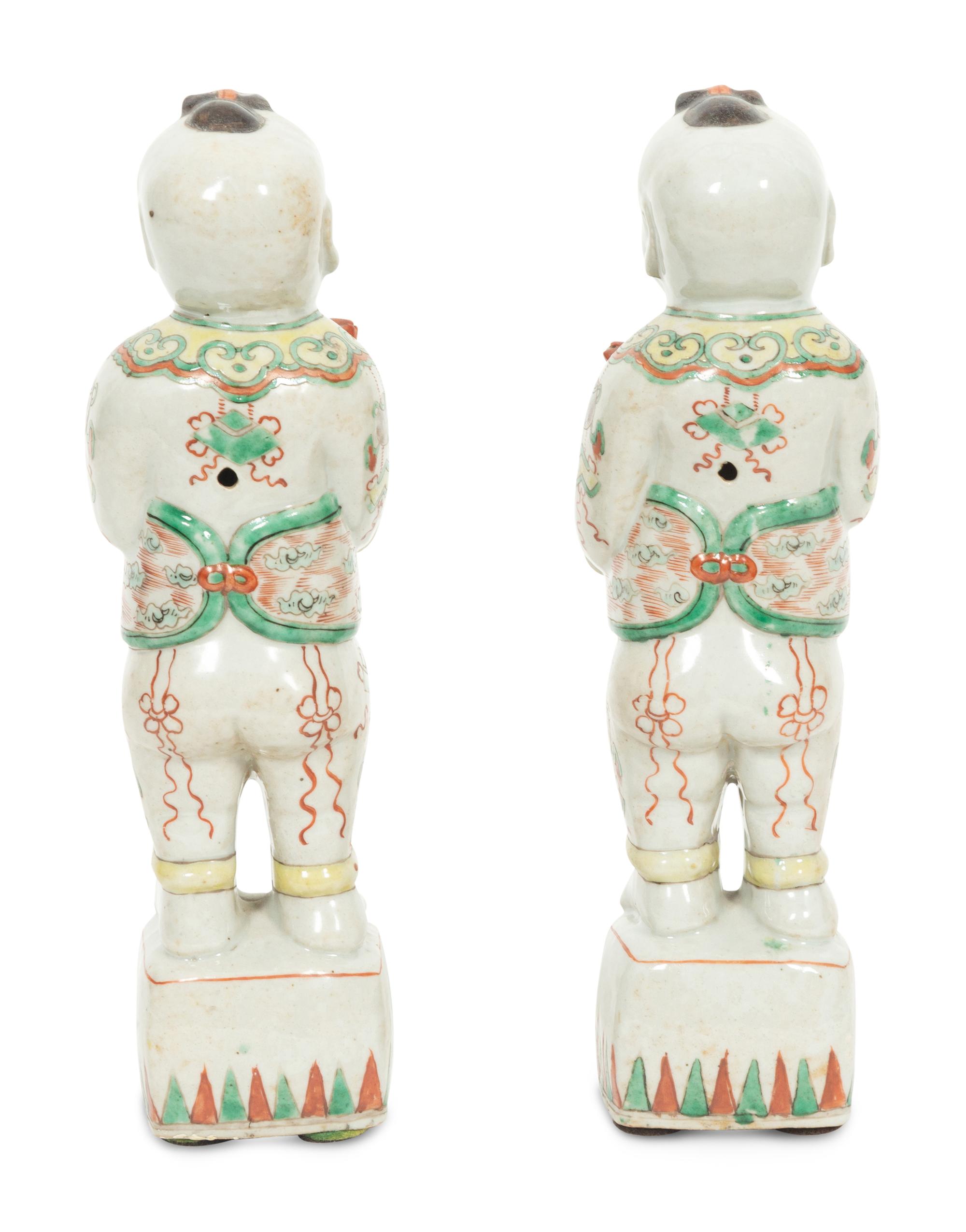 A Pair of Chinese Porcelain Figures of Boys