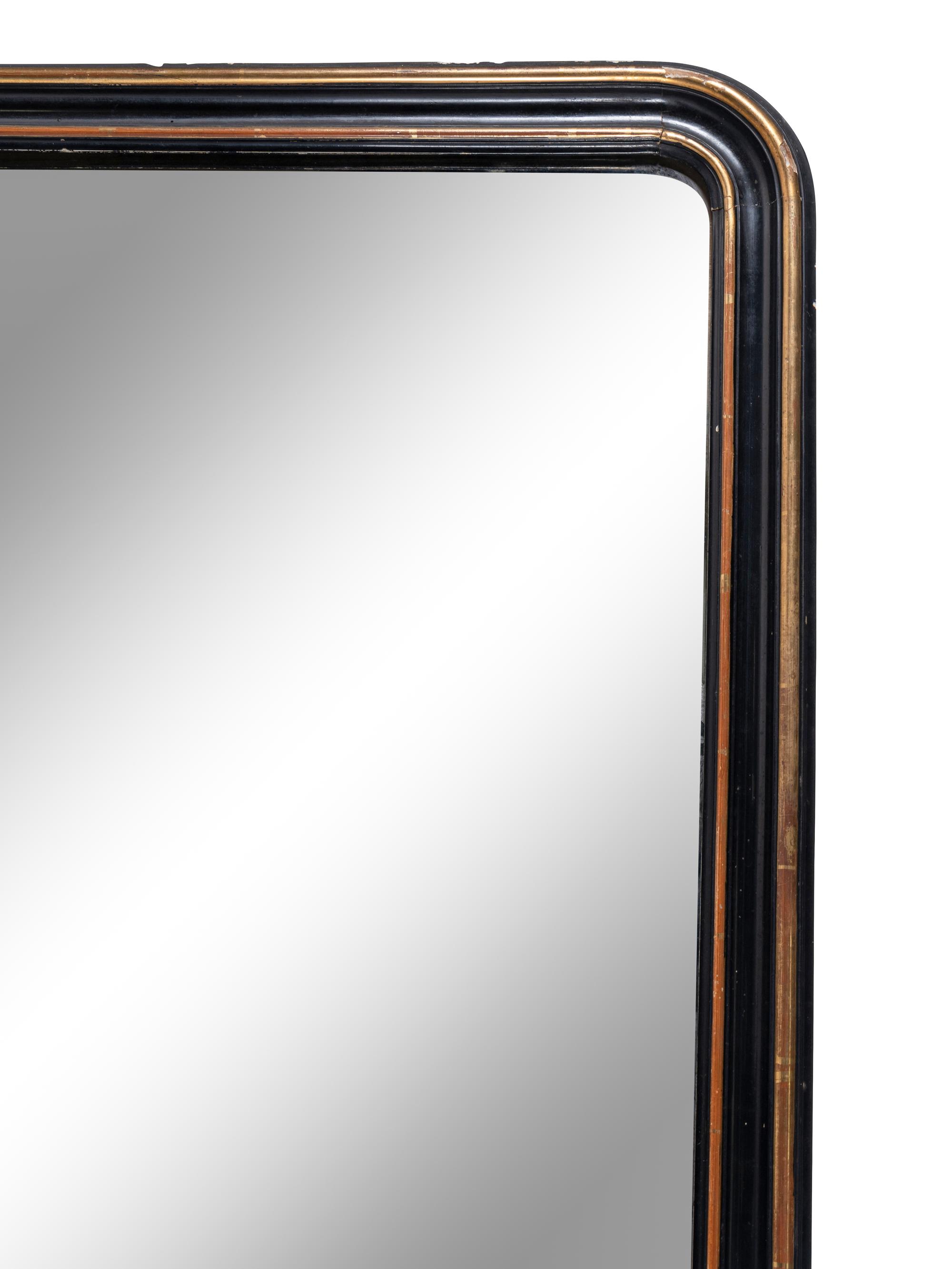 A Large Continental Gilt and Ebonized Overmantel Mirror