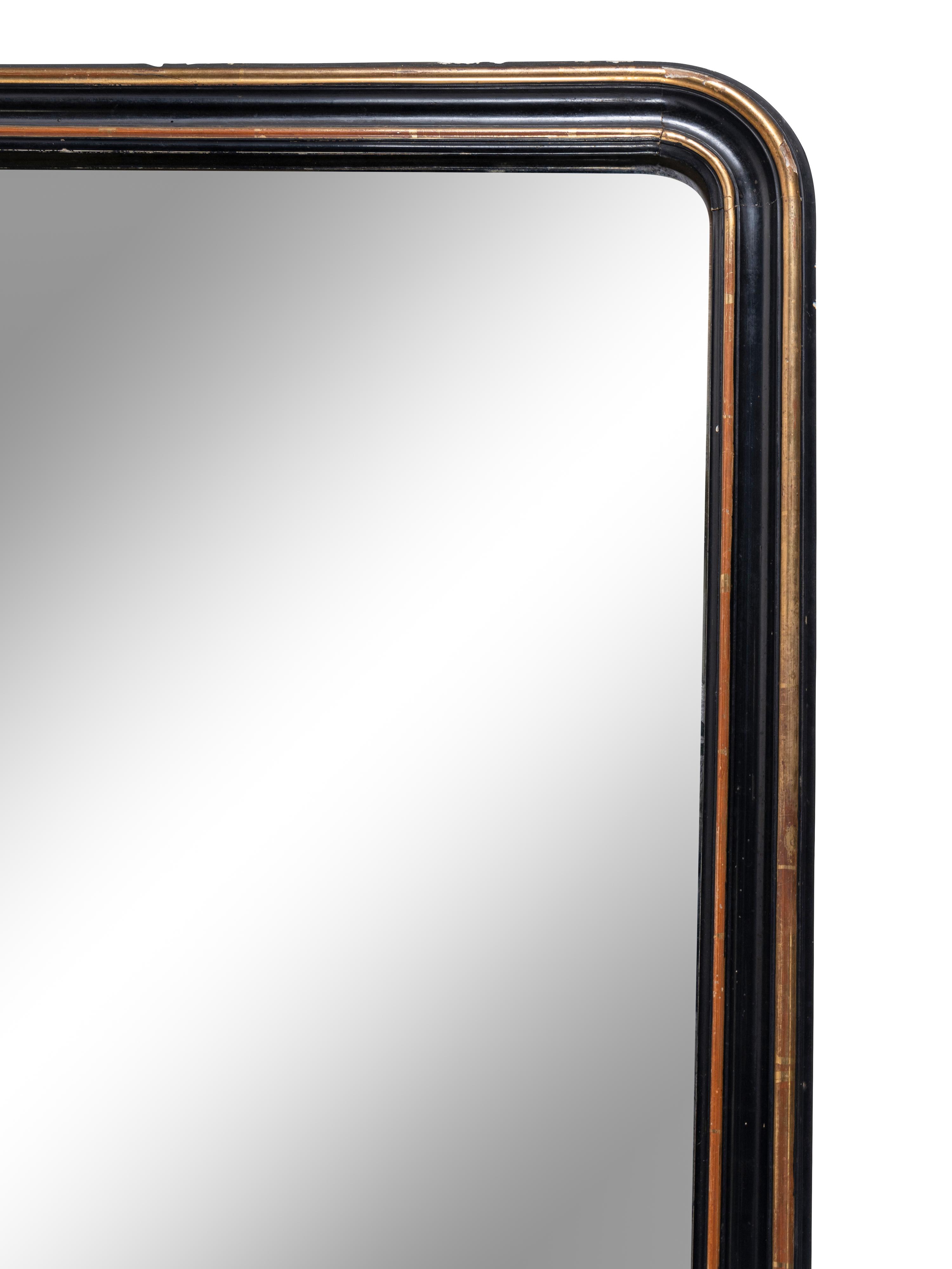 A Large Continental Gilt and Ebonized Overmantel Mirror