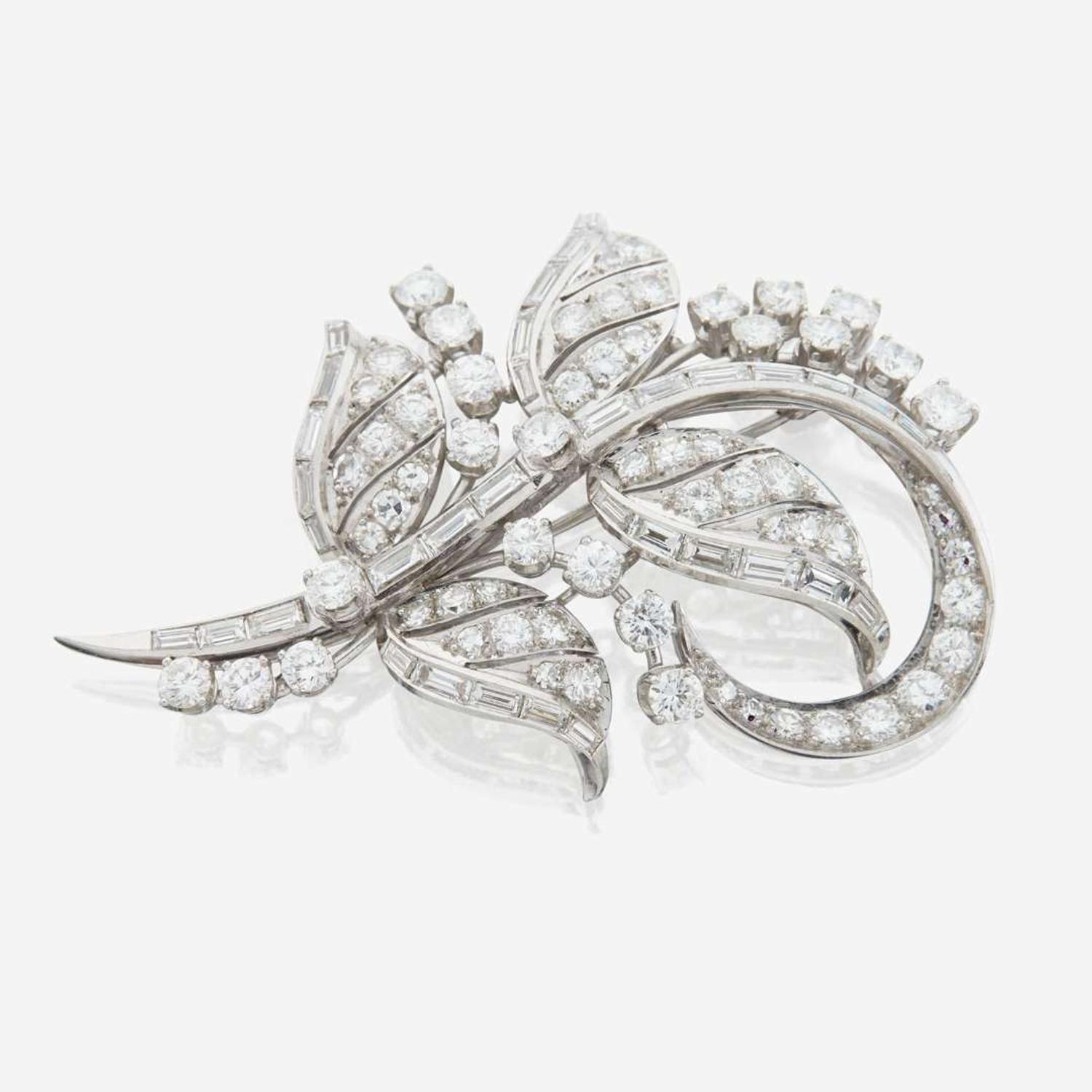 A diamond and platinum brooch