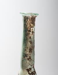 A Roman Pale Blue Glass Unguentarium