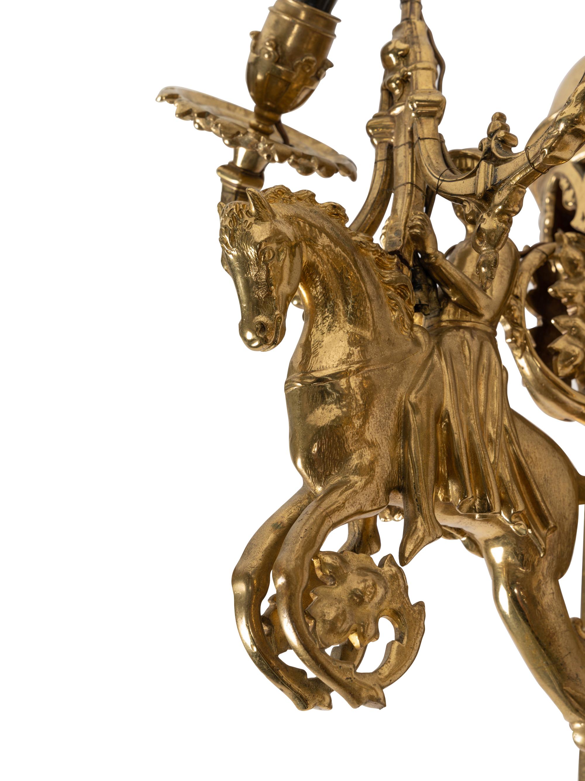 A Pair of Gothic Style Brass Three-Light Sconces