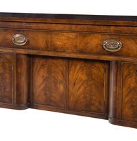 A Regency Style Mahogany Sideboard with Silk Drape on a Brass Gallery