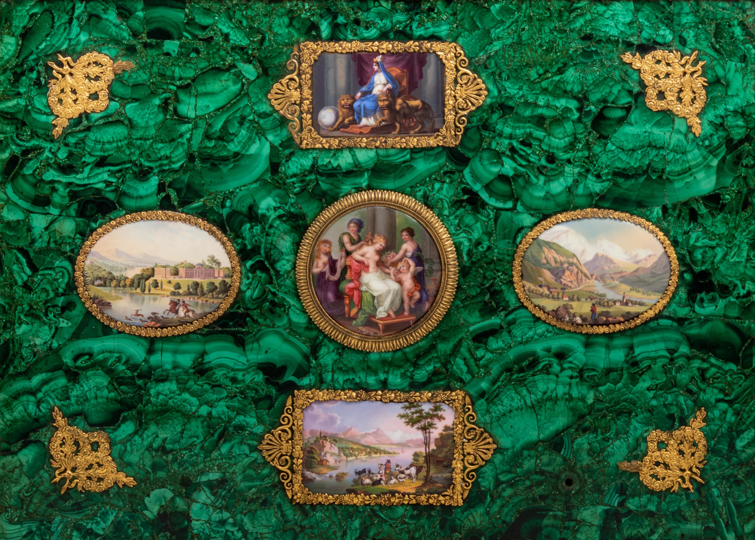 An Enamel Plaque and Gilt Metal Mounted Malachite Veneered Panel in a Giltwood Hinged Frame