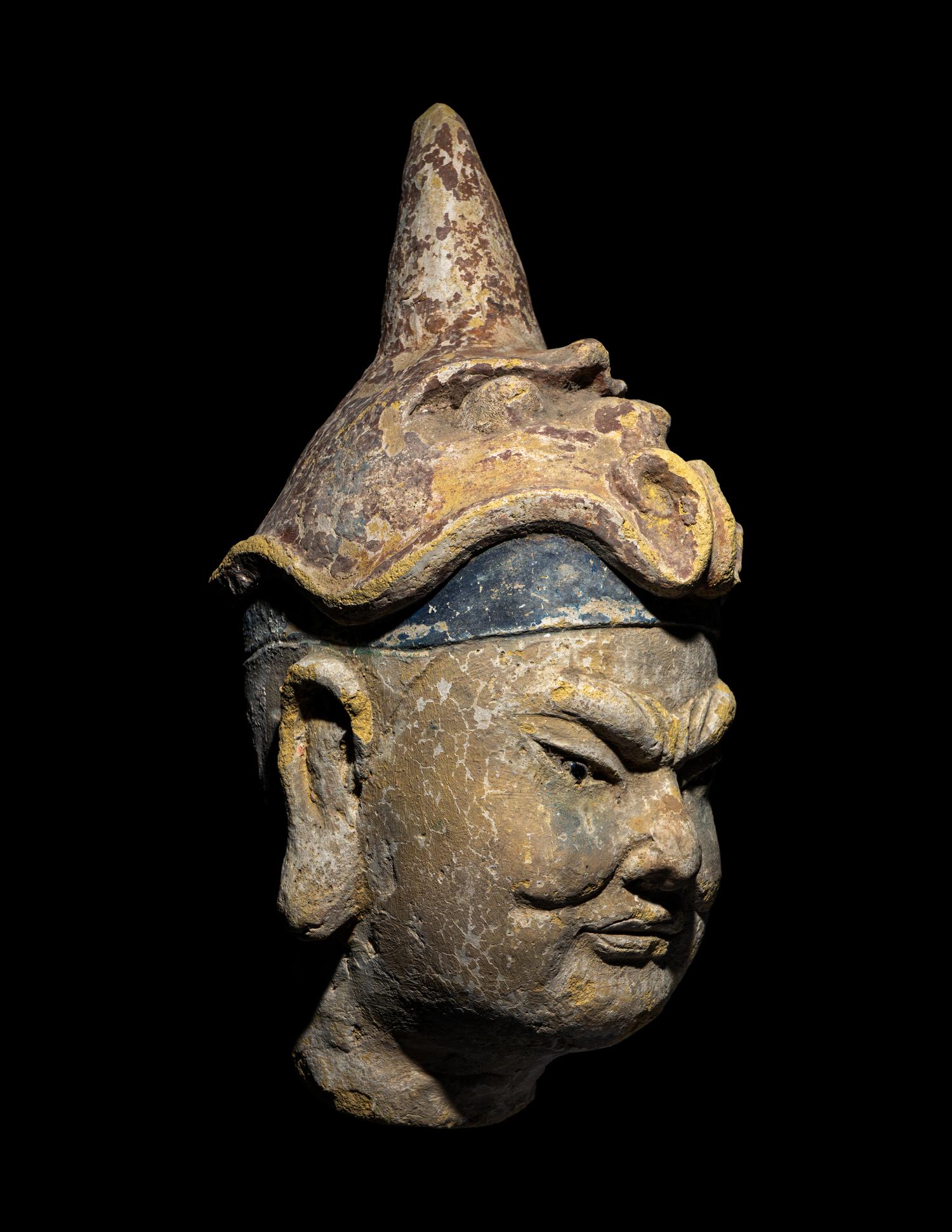 A Polychrome Stucco Head of a Temple Guardian