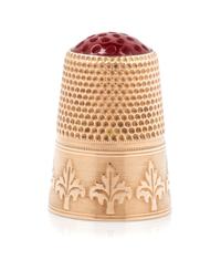 A Continental 12-Karat Gold and Hardstone Thimble, , the hardstone top and knurled body above a foliate decorated band on an engine tur