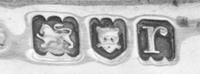 A George V Silver Toast Warming Rack, maker's mark obscured, London, 1912, the four-slice rack with a removable base plate raised on a