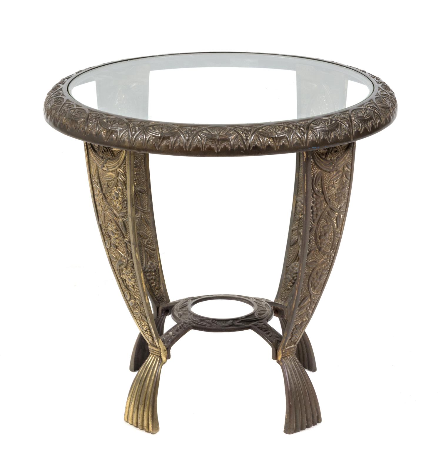 An American Cast Iron Art Deco Side Table, Seville Studios Height 16 x diameter 21 inches.