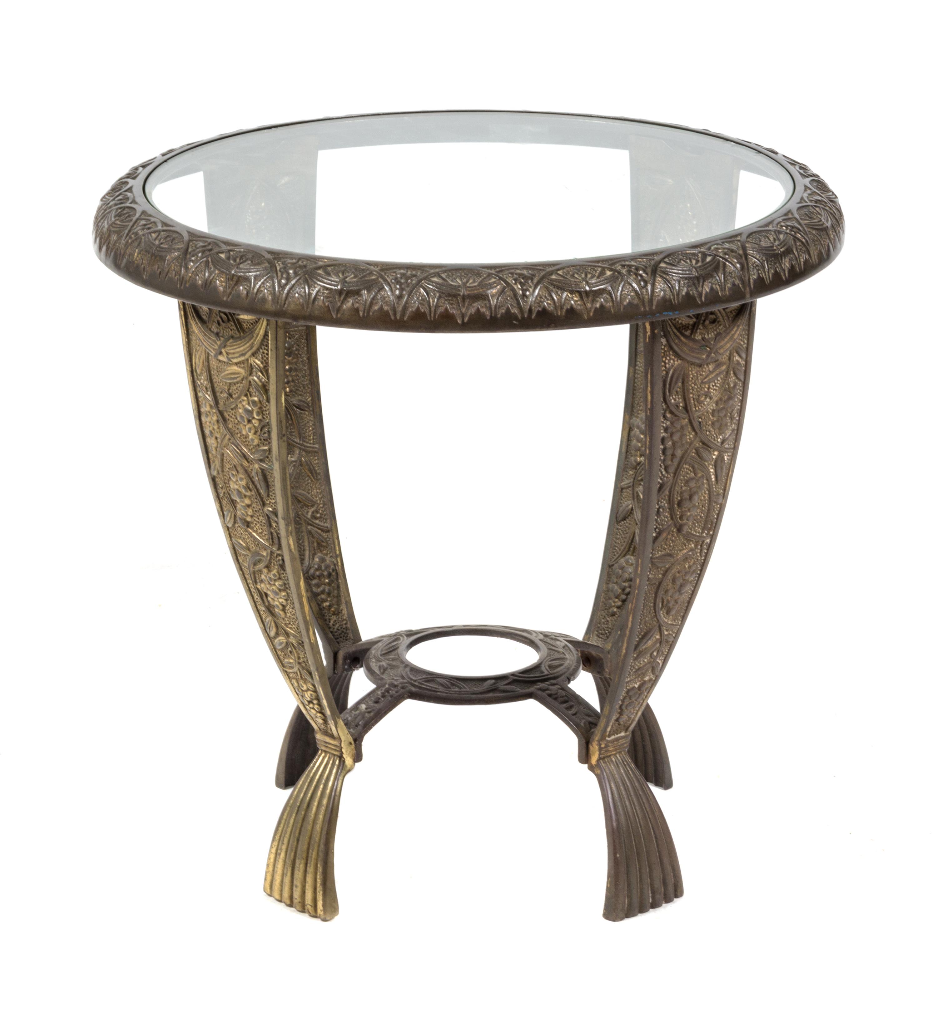 An American Cast Iron Art Deco Side Table, Seville Studios Height 16 x diameter 21 inches.