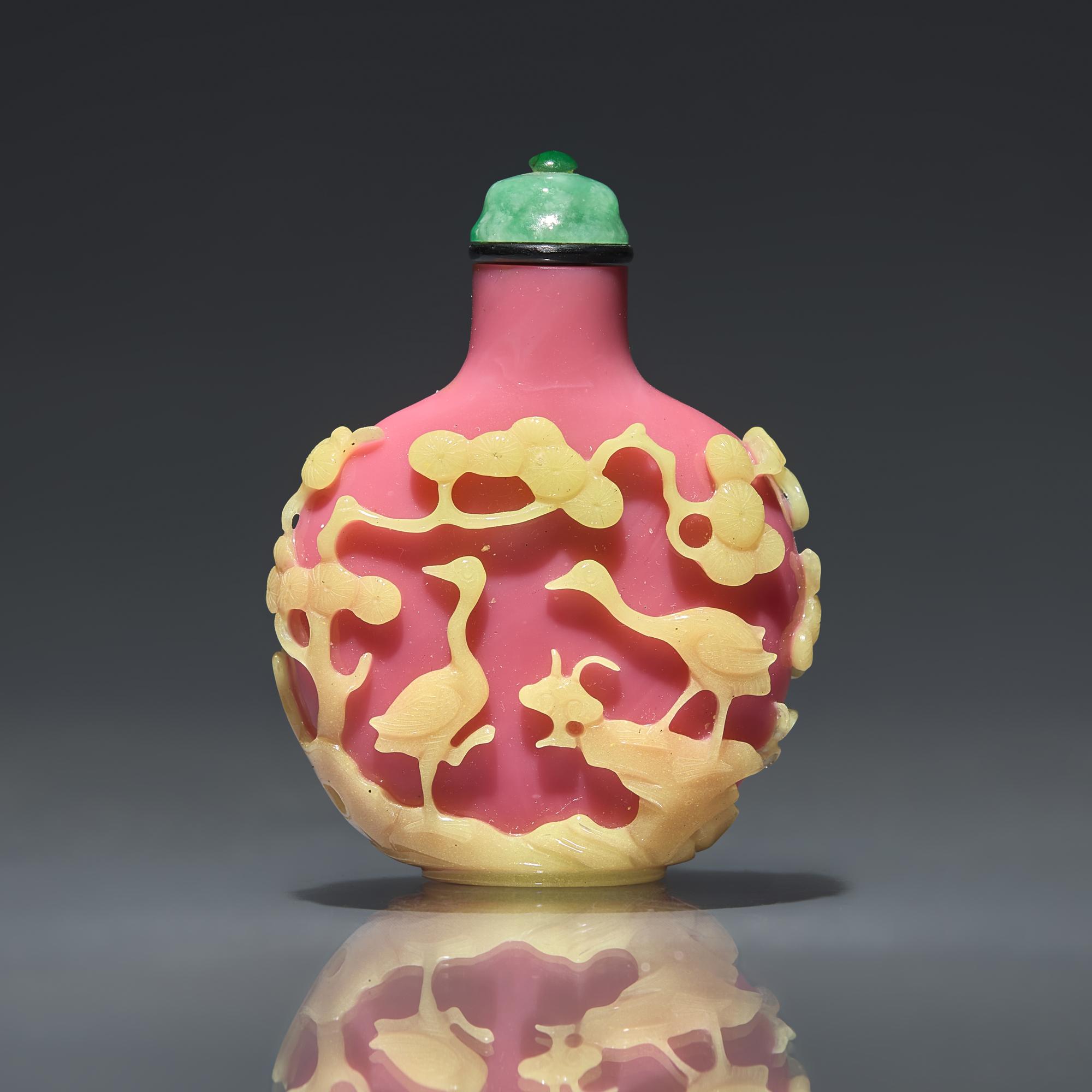 A Chinese Yellow-Overlaid Pink Glass Snuff Bottle, Qing Dynasty, Circa 1780-1860 — 1780-1860年 粉紅地套黃料鹿鶴同春圖鼻煙壺