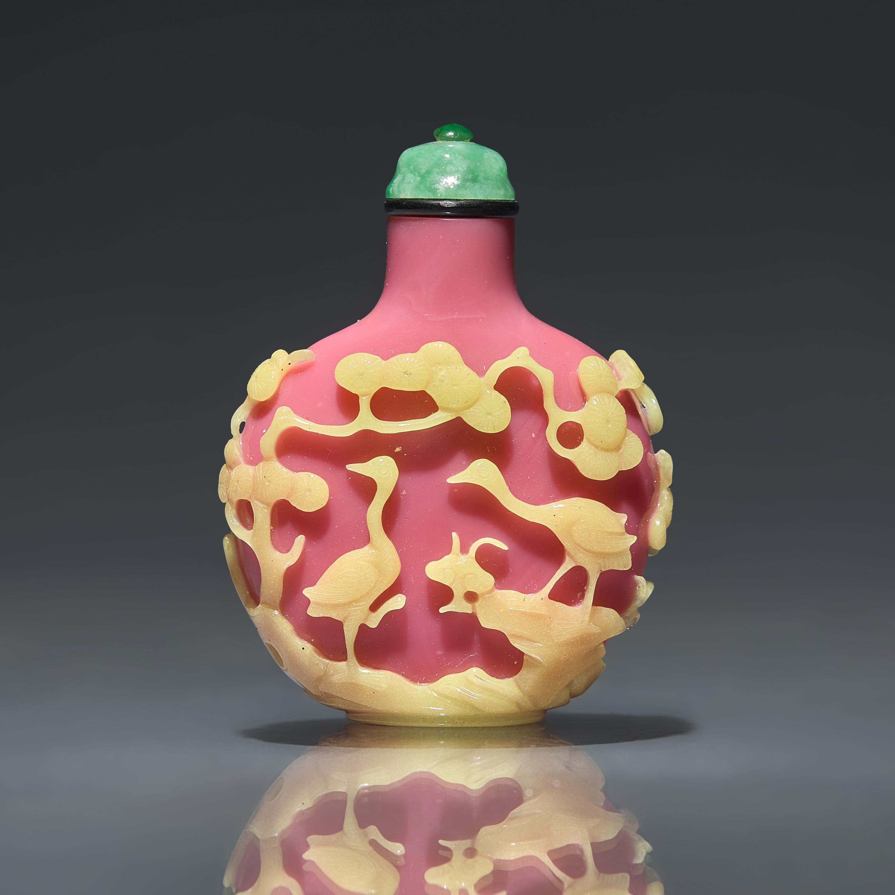 A Chinese Yellow-Overlaid Pink Glass Snuff Bottle, Qing Dynasty, Circa 1780-1860 — 1780-1860年 粉紅地套黃料鹿鶴同春圖鼻煙壺