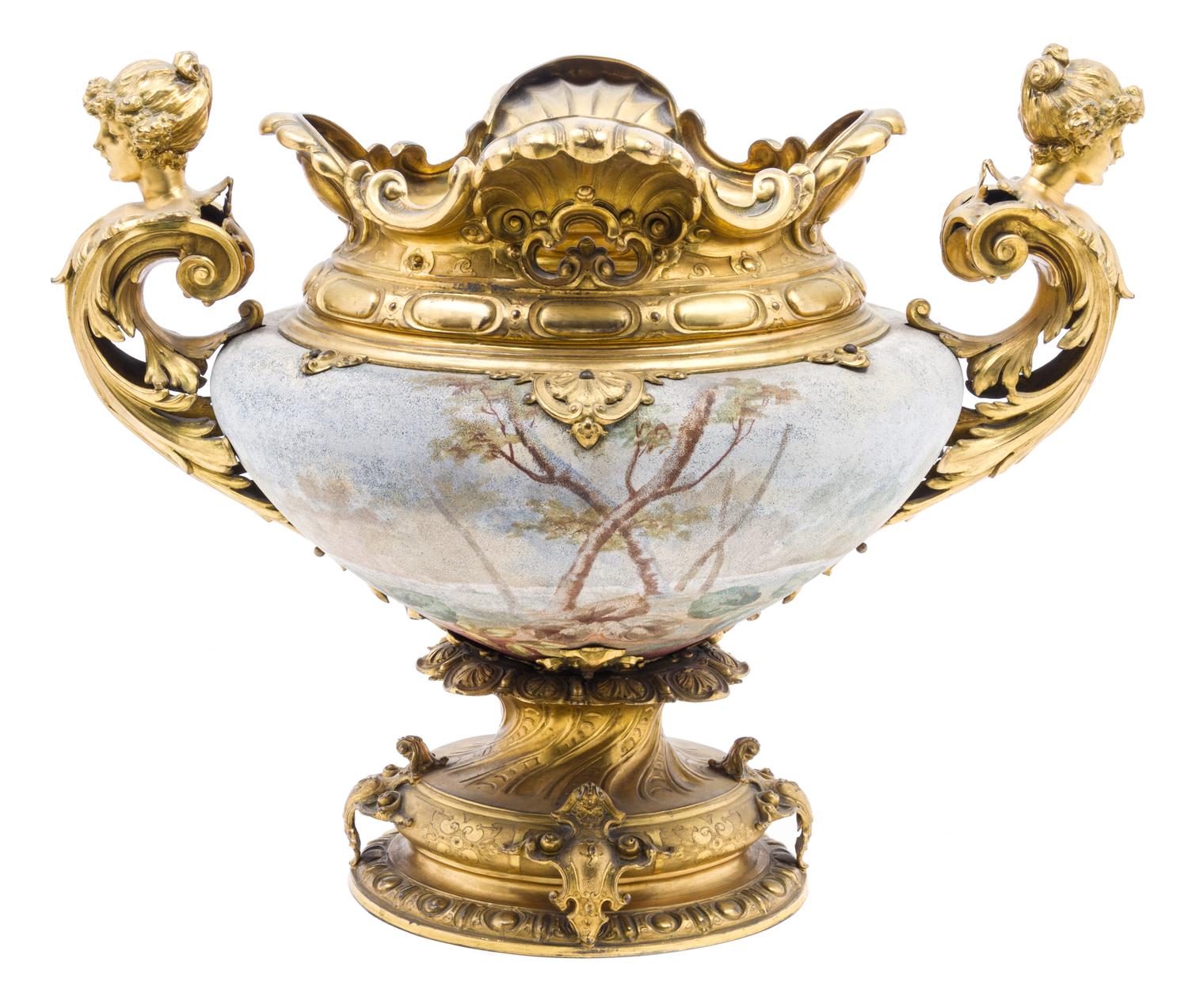 A French Gilt Metal Mounted Ceramic Urn Height 16 1/2 x width over handes 21 inches.