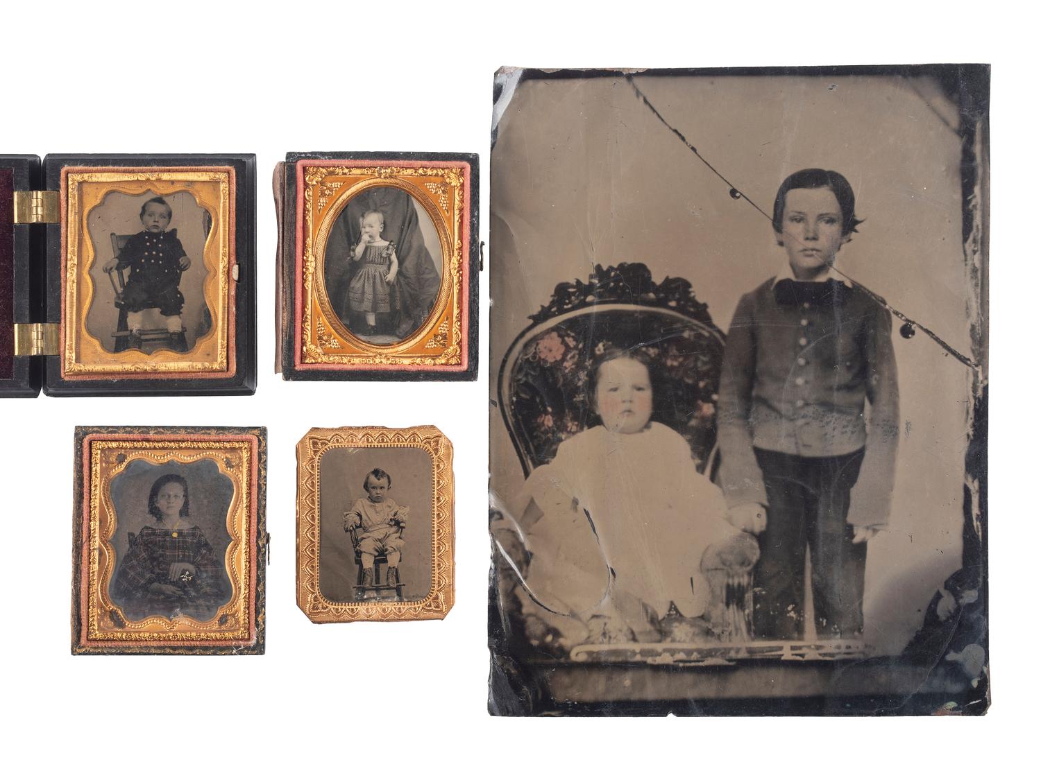 [EARLY PHOTOGRAPHY]. A group of 19 ambrotypes and tintypes of children of varying ages, some posed with their parents, incl. African American infant and pairs of images taken during the same sitting.