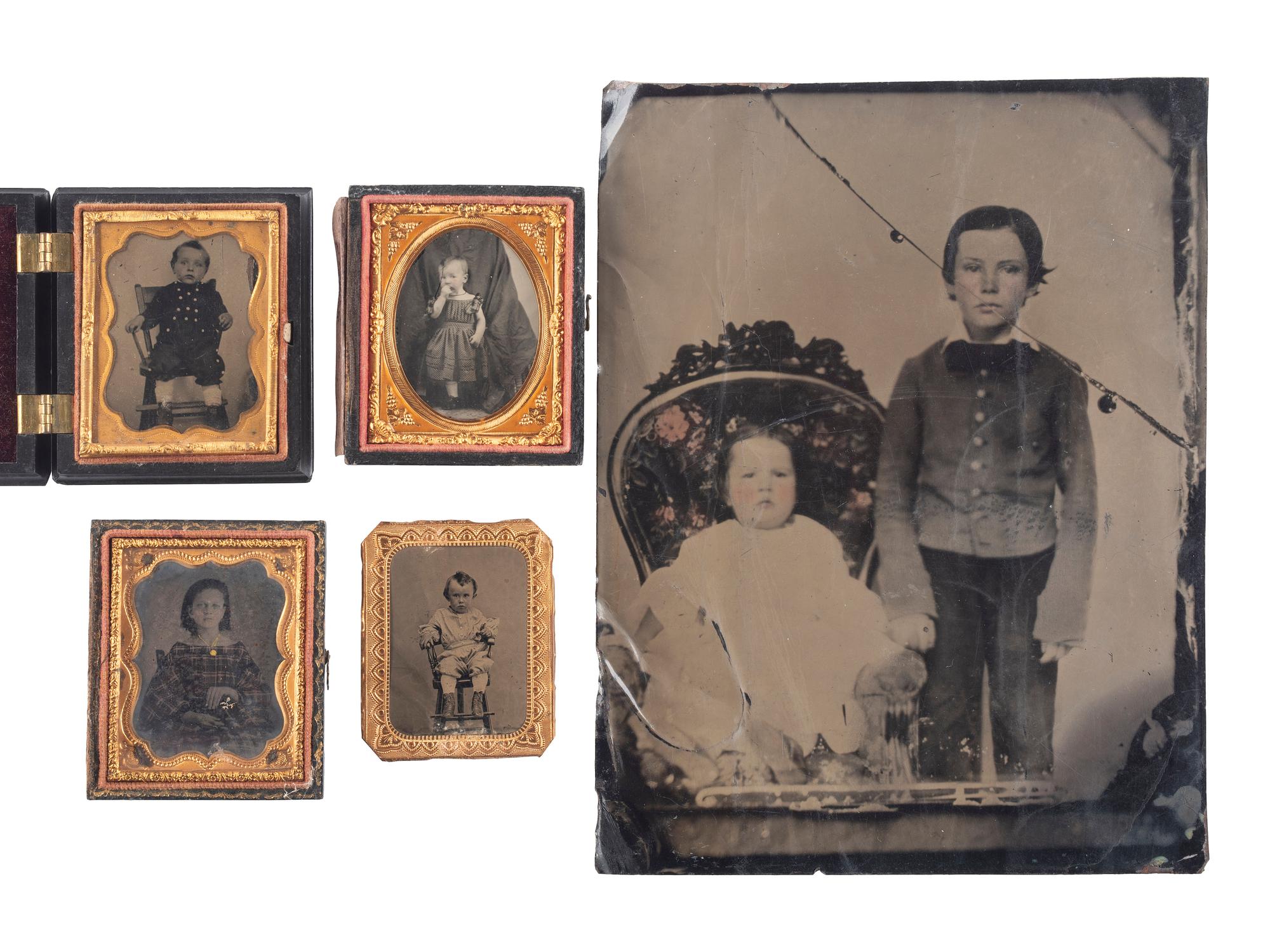 [EARLY PHOTOGRAPHY]. A group of 19 ambrotypes and tintypes of children of varying ages, some posed with their parents, incl. African American infant and pairs of images taken during the same sitting.