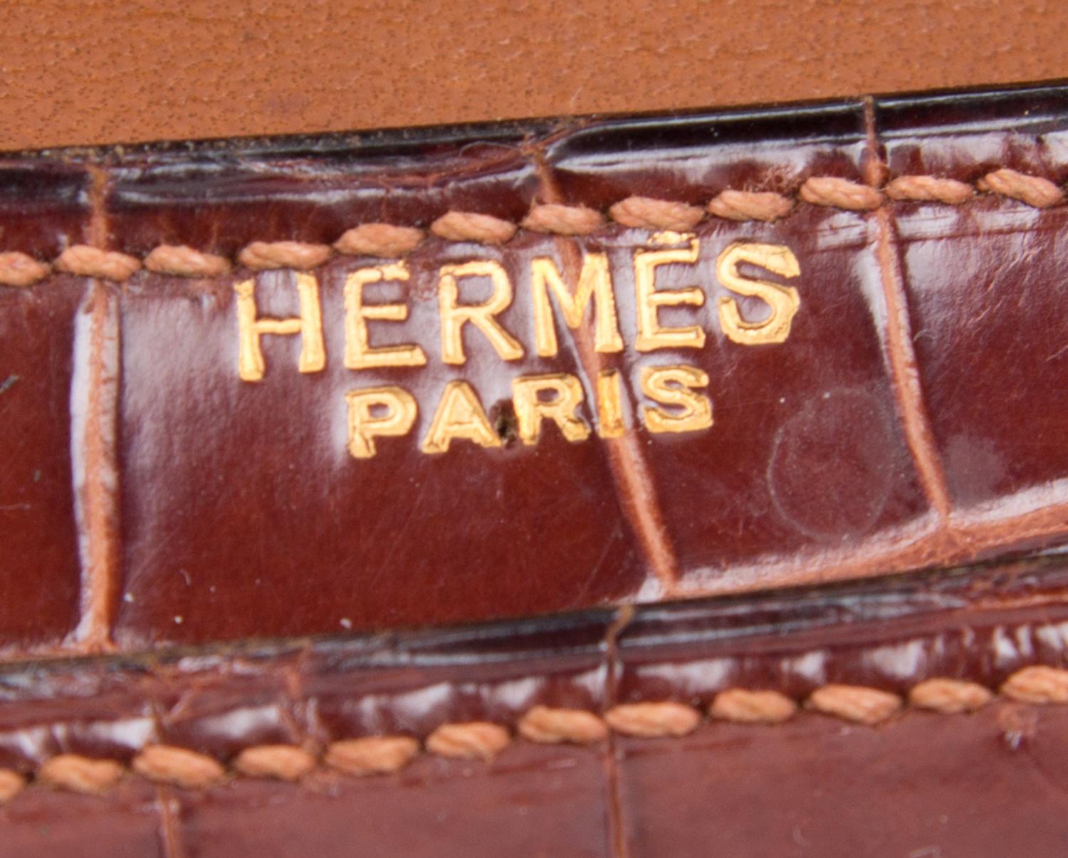 An Hermes Brown Crocodile Handbag, 9.5" x 7.5" x 1.5".