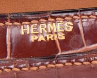 An Hermes Brown Crocodile Handbag, 9.5" x 7.5" x 1.5".