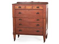 An Ohio Mennonite Red-Stained Cherrywood and Tiger Maple Chest of Drawers