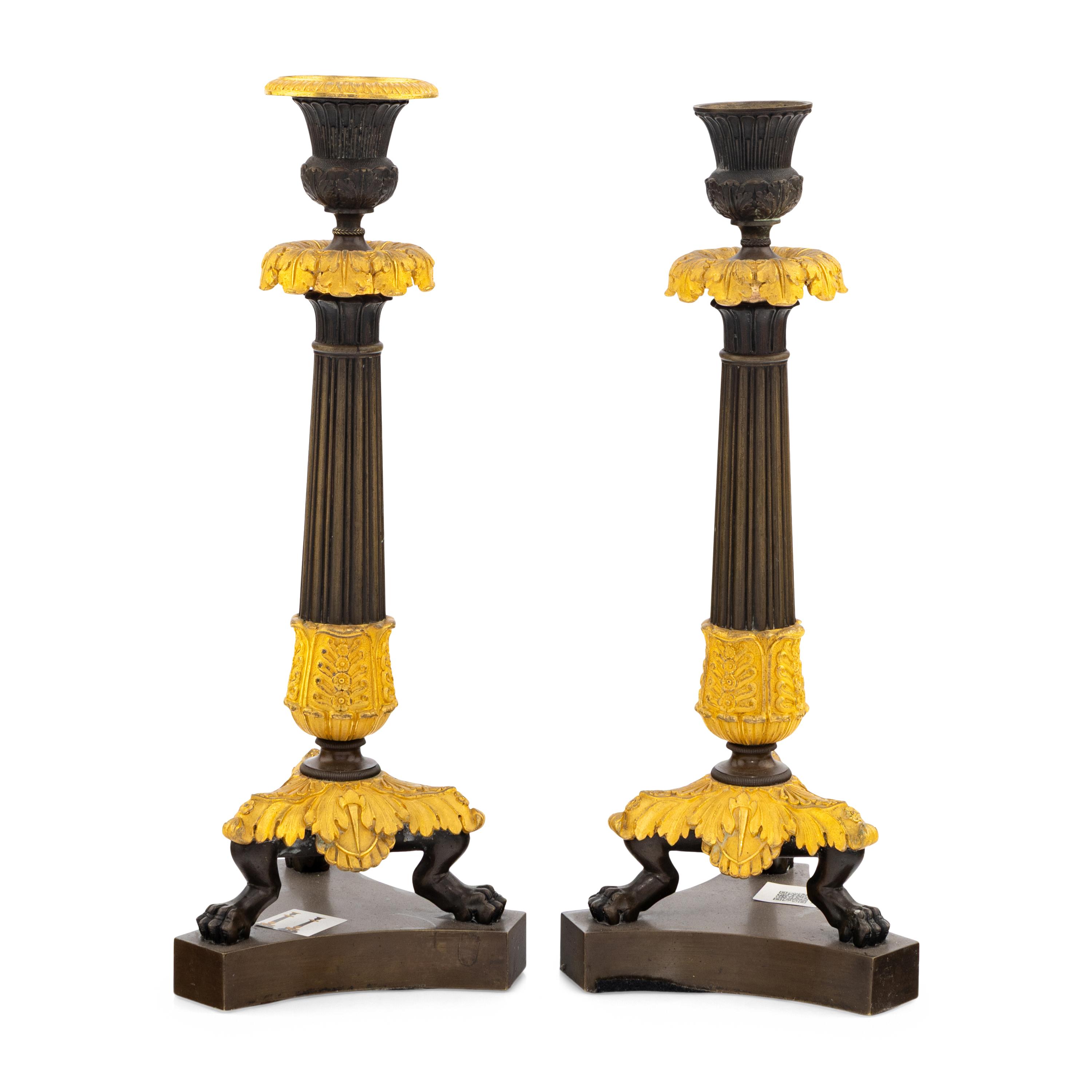 A Pair of Charles X Gilt and Patinated Bronze Candlesticks
