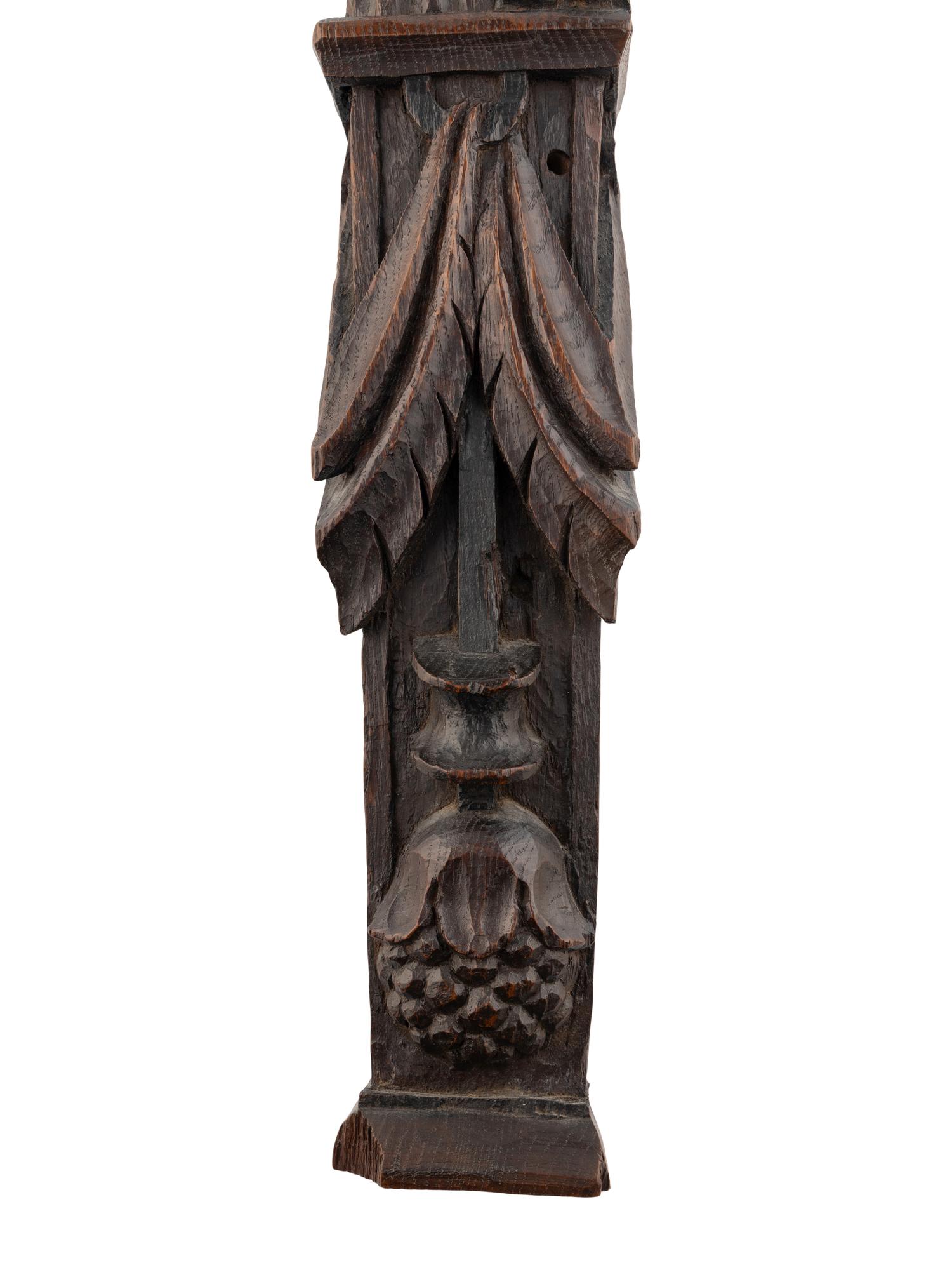 A Carved Oak and Polychrome Decorated Figural Pilaster