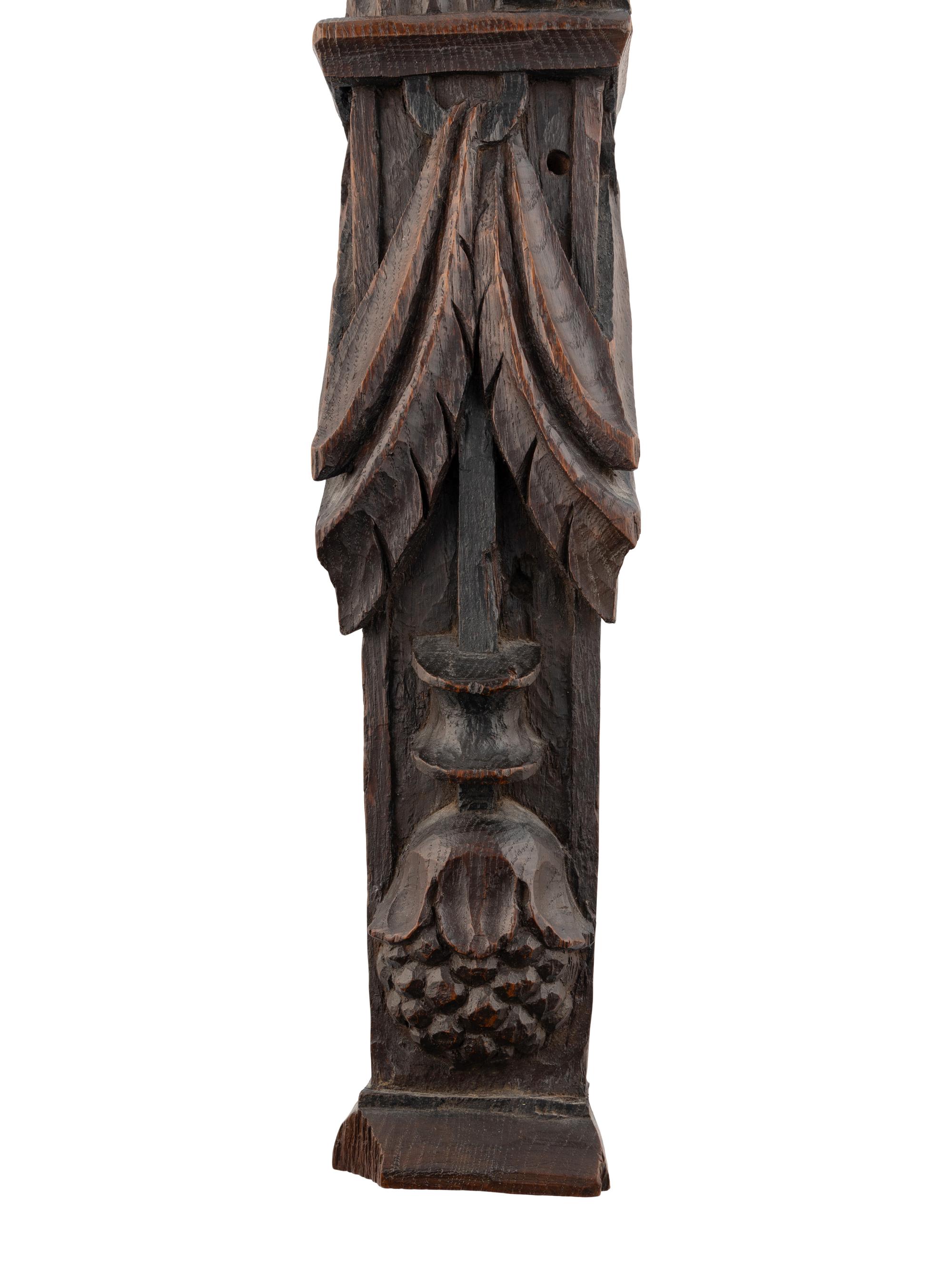 A Carved Oak and Polychrome Decorated Figural Pilaster