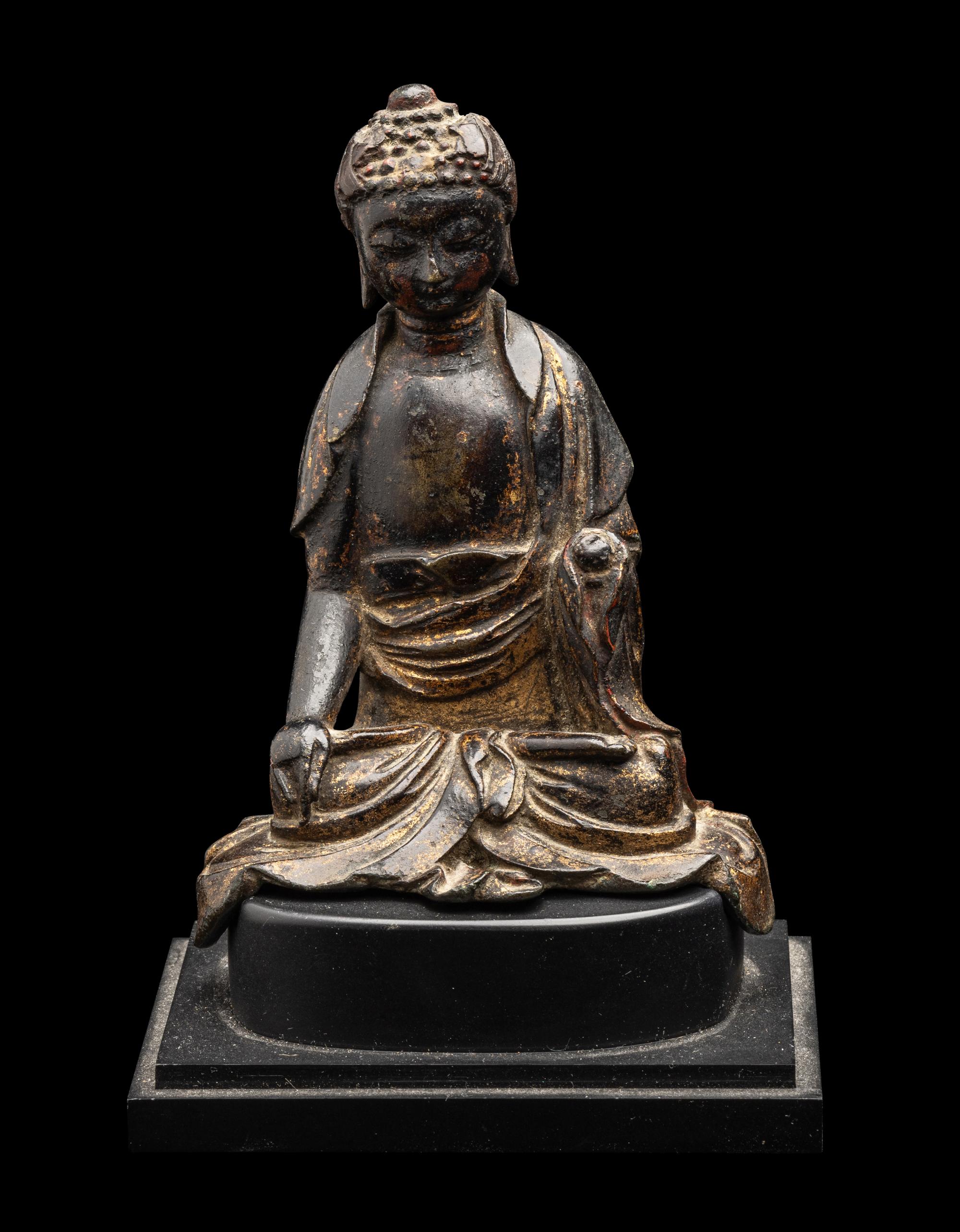 A Chinese Parcel-Gilt Bronze Figure of Buddha Shakyamuni, Ming Dynasty or Earlier 明或更早 銅局部鎏金坐佛