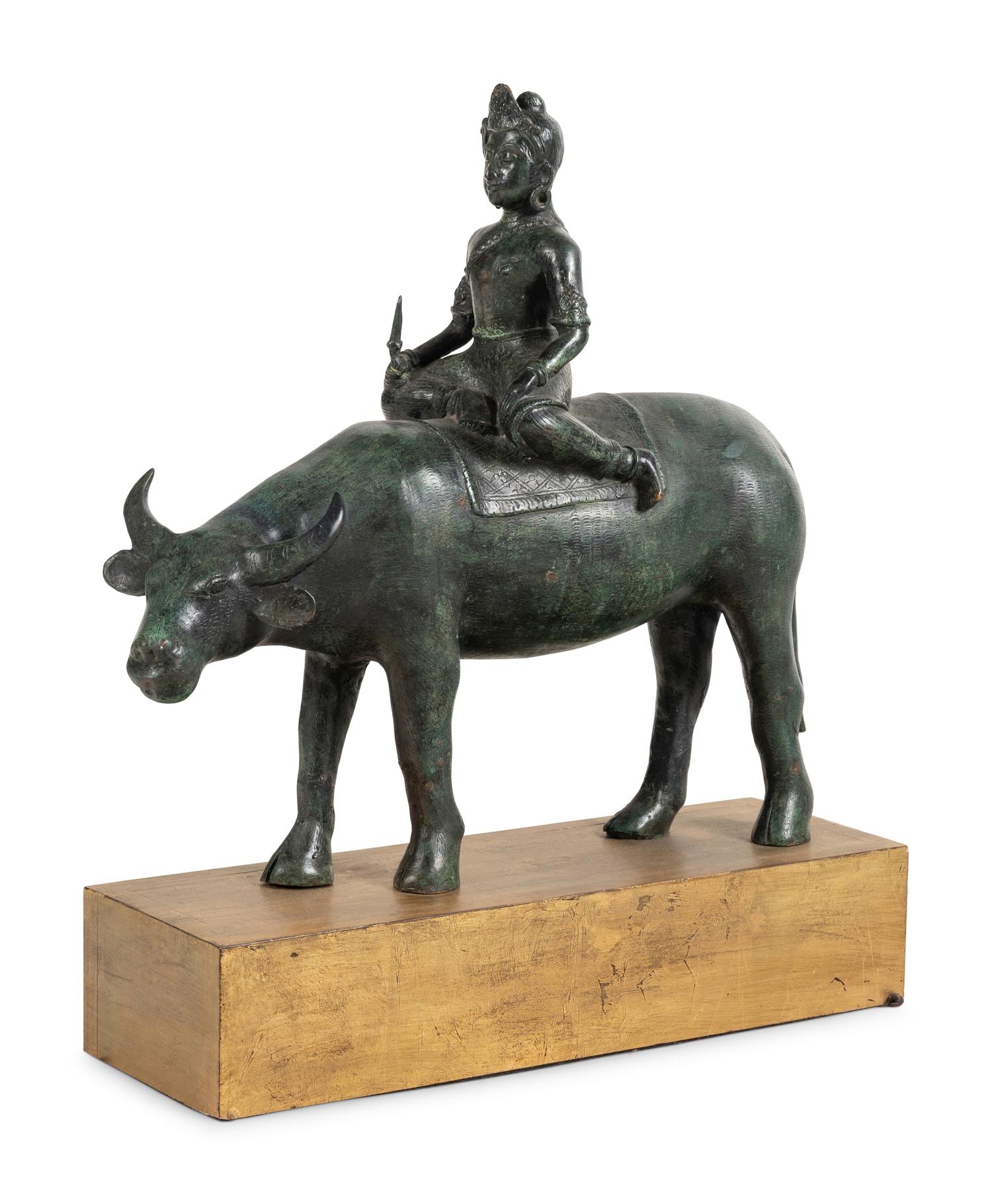 An Indian or Southeast Asian Bronze Model of a Figure on a Water Buffalo