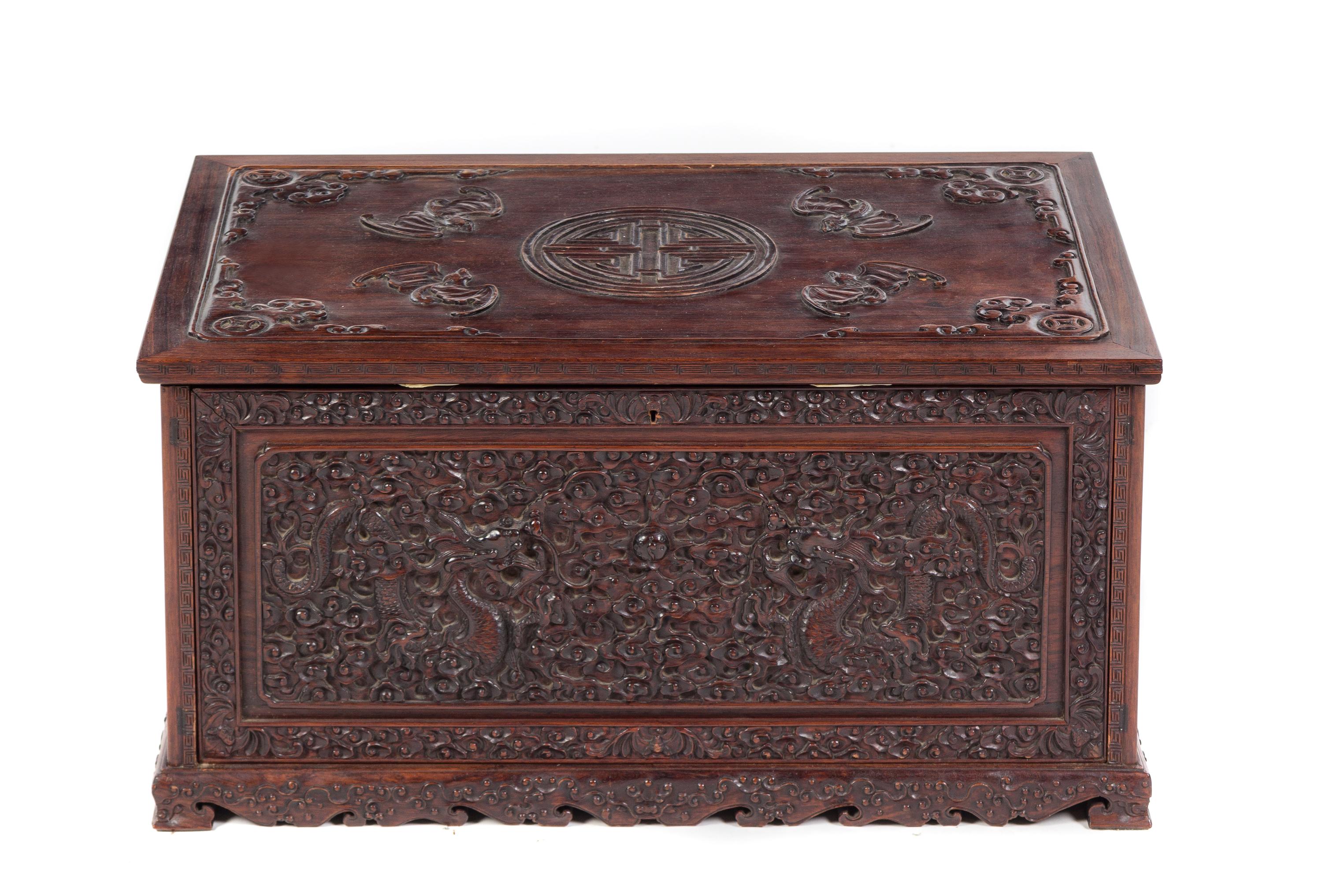 A Chinese Relief Carved Hardwood Chest 19TH CENTURY Height 13 3/4 x width 27 5/8 x depth 17 1/4 inches. — 19TH CENTURY
