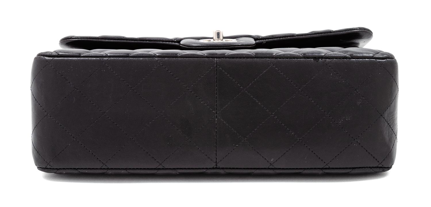 A Chanel Black Quilted Lambskin Jumbo Double Flap Bag, 8.25" H x 12" W x 3.5" D; Strap drop: 13.5"- 23.75".