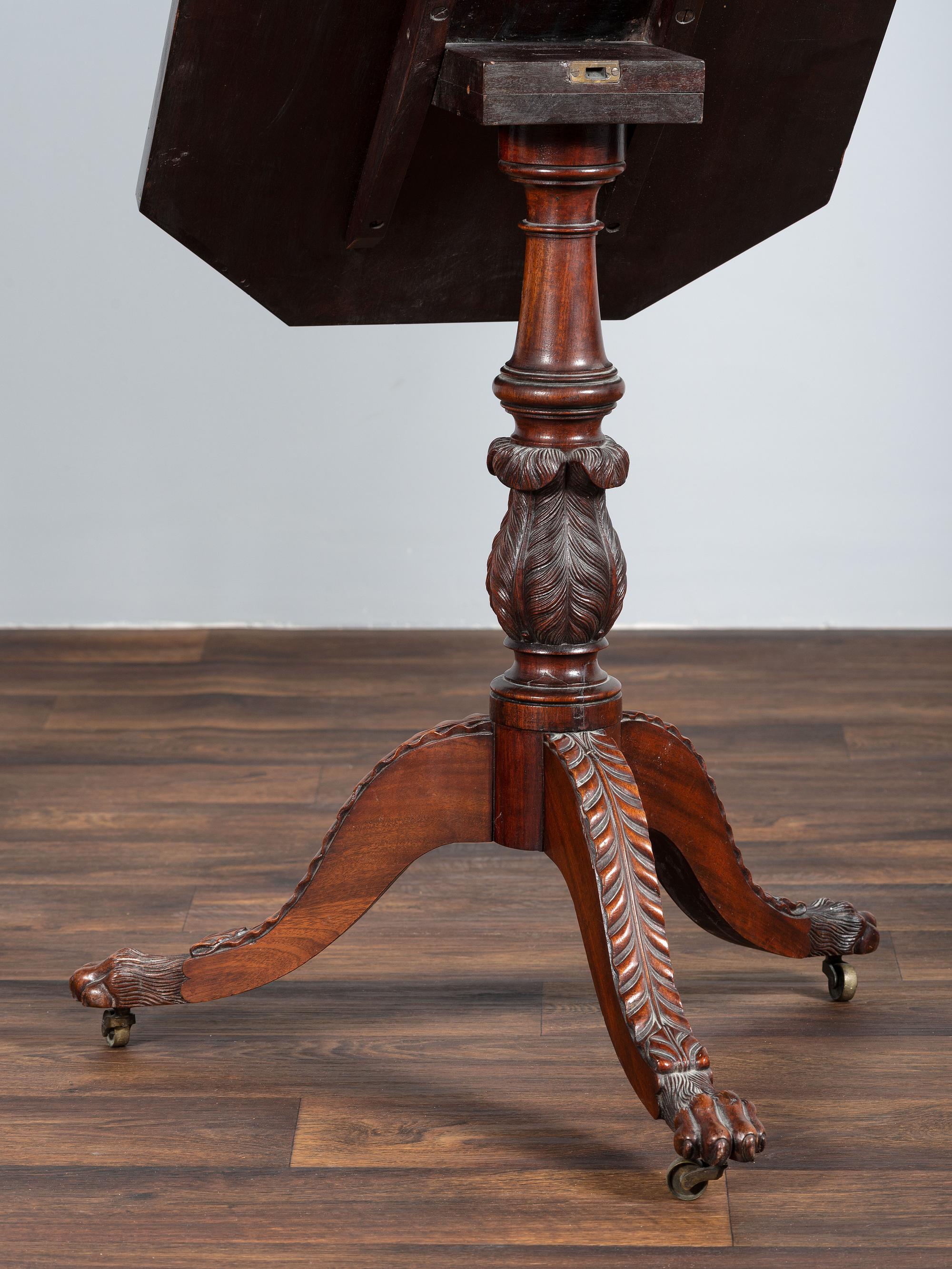 A Late Federal Carved and Figured Mahogany Octagonal Tilt-Top Candlestand