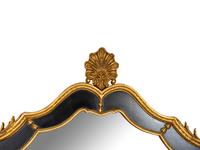 A Pair of Large Ebonized and Parcel Gilt Pier Mirrors
