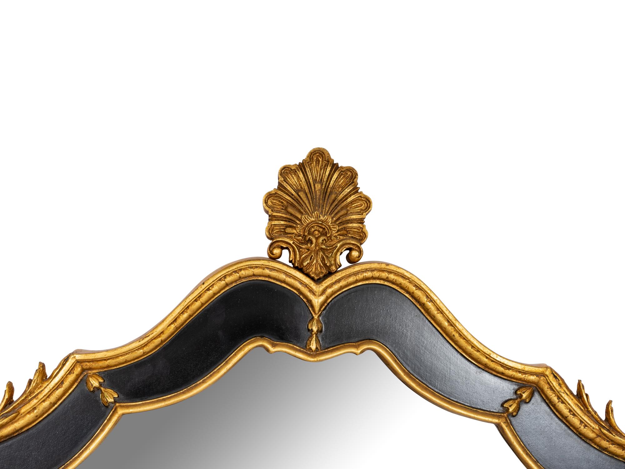 A Pair of Large Ebonized and Parcel Gilt Pier Mirrors