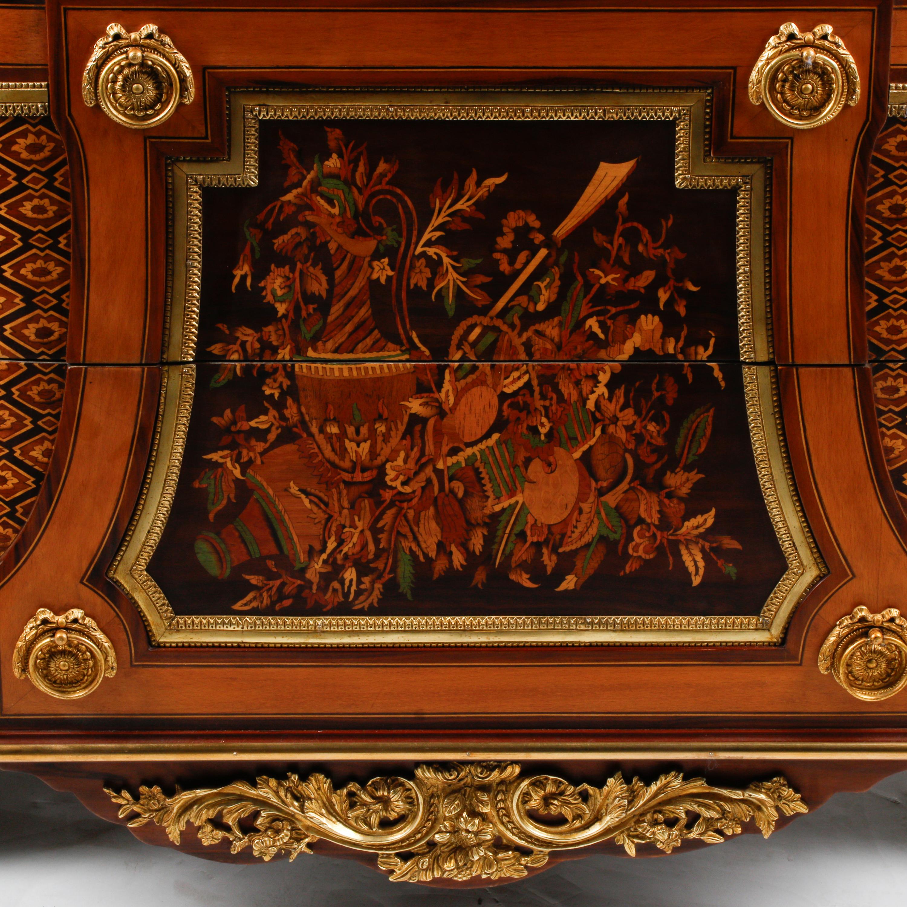A Louis XVI Style Gilt Bronze Mounted Marquetry Marble-Top Commode