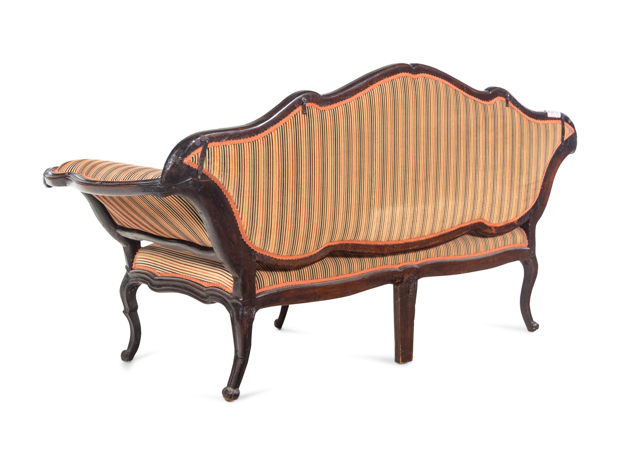 An Italian Carved Walnut Settee