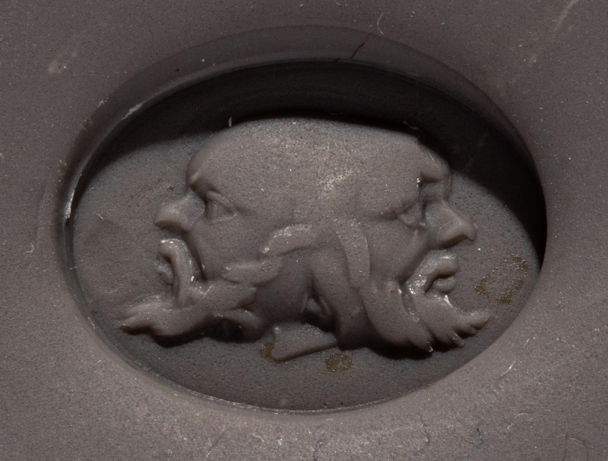 A Roman Red Jasper Ring Stone with a Three-Faced Gryllos
