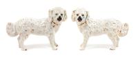 A Pair of Staffordshire Style Great Pyrenees Figures Width 16 inches.