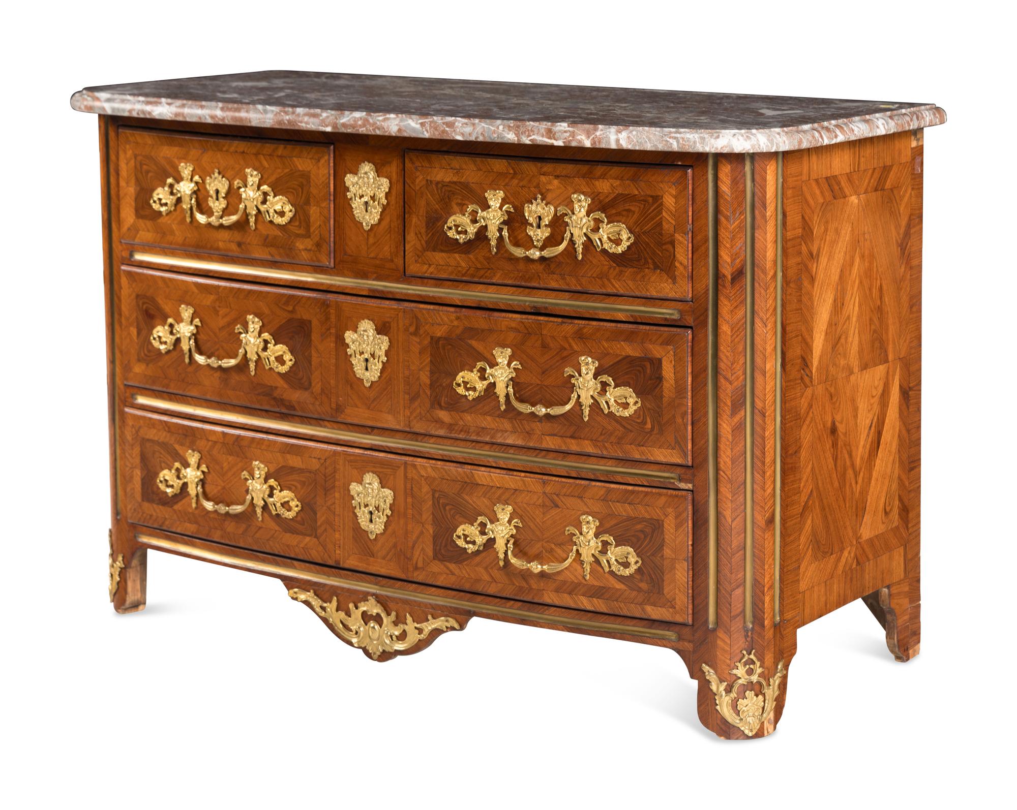 A Régence Gilt Bronze Mounted Walnut Parquetry Commode