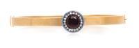 A Victorian 15 Karat Rose Gold, Garnet, Diamond and Enamel Bangle Bracelet, 14.10 dwts.