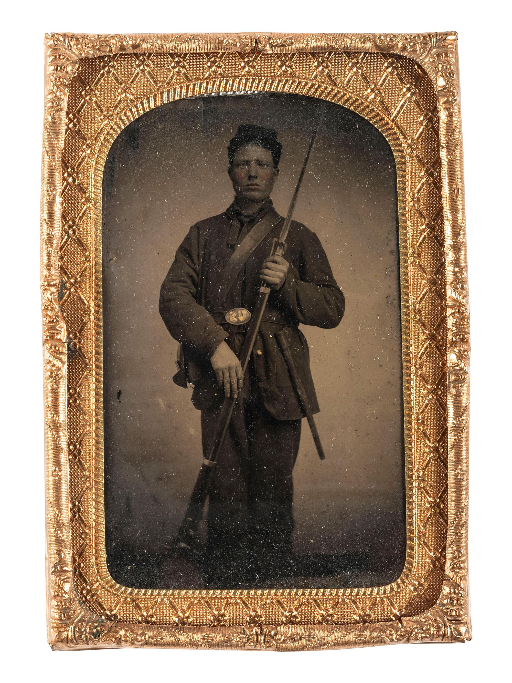 [CIVIL WAR]. Tintype of Private Oliver W. Inskeep, Company F, 30th Iowa Regiment, with musket and fixed bayonet.