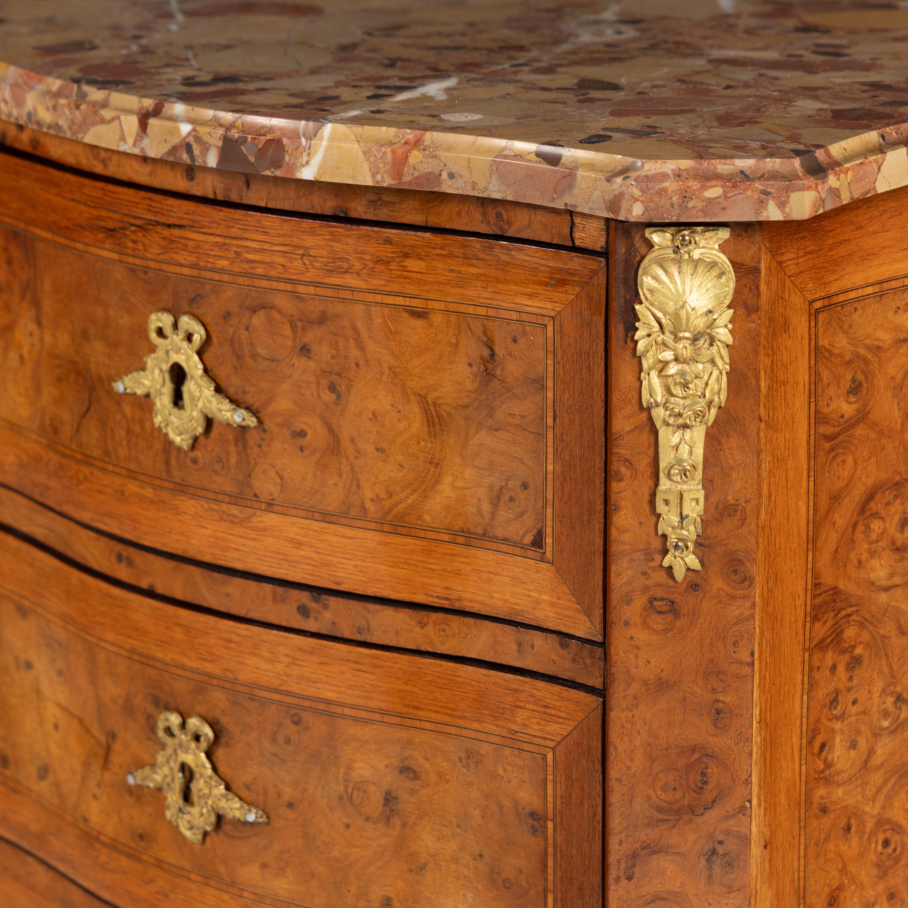 A Pair of Louis XV/XVI Transitional Style Gilt Bronze Mounted Walnut and Marble-Top Commodes
