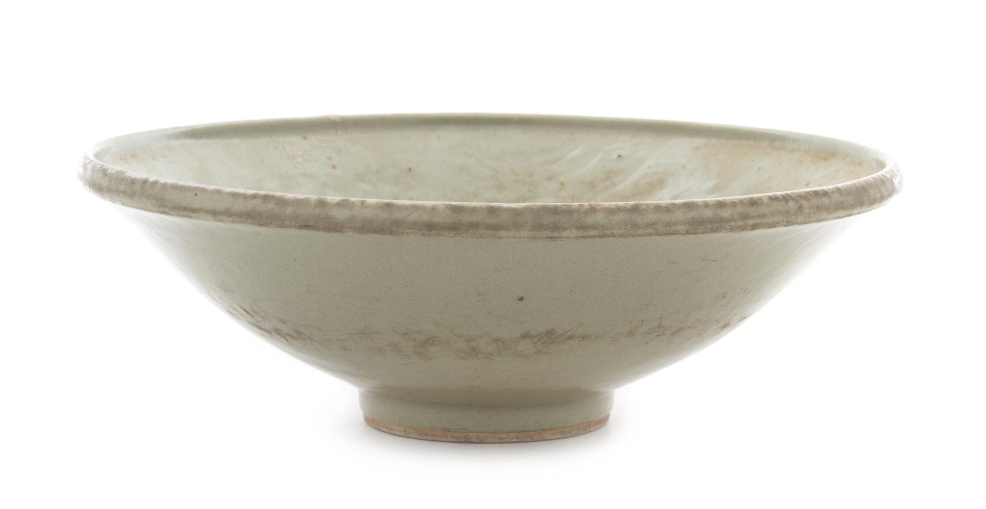 A Korean Light Celadon Glazed Porcelain Bowl Diameter 10 3/4 inches.