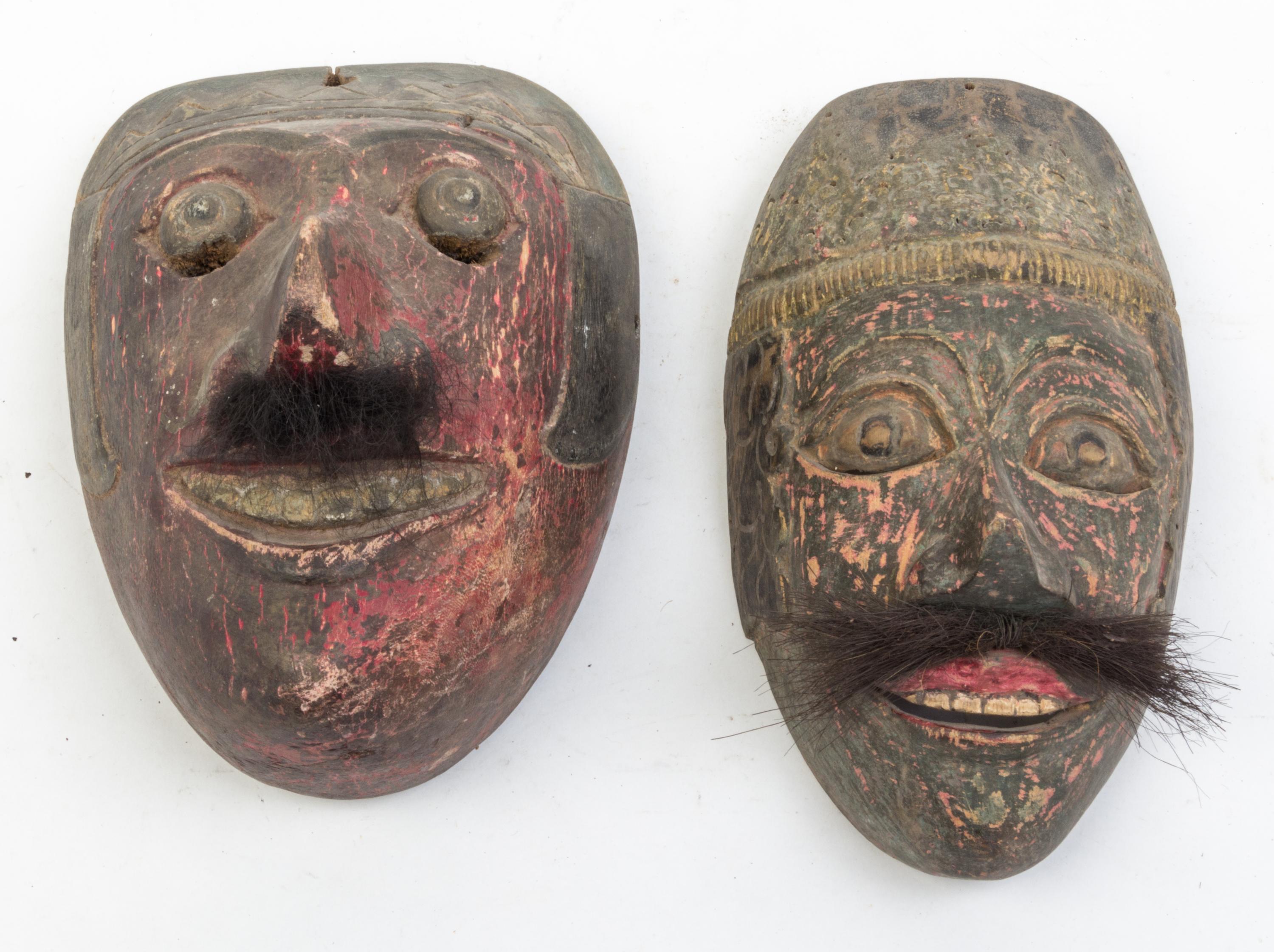 Five Mexican Painted Masks Height of largest 25 inches.