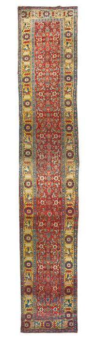A Persian Wool Runner 22 feet 2 inches x 3 feet 8 inches.